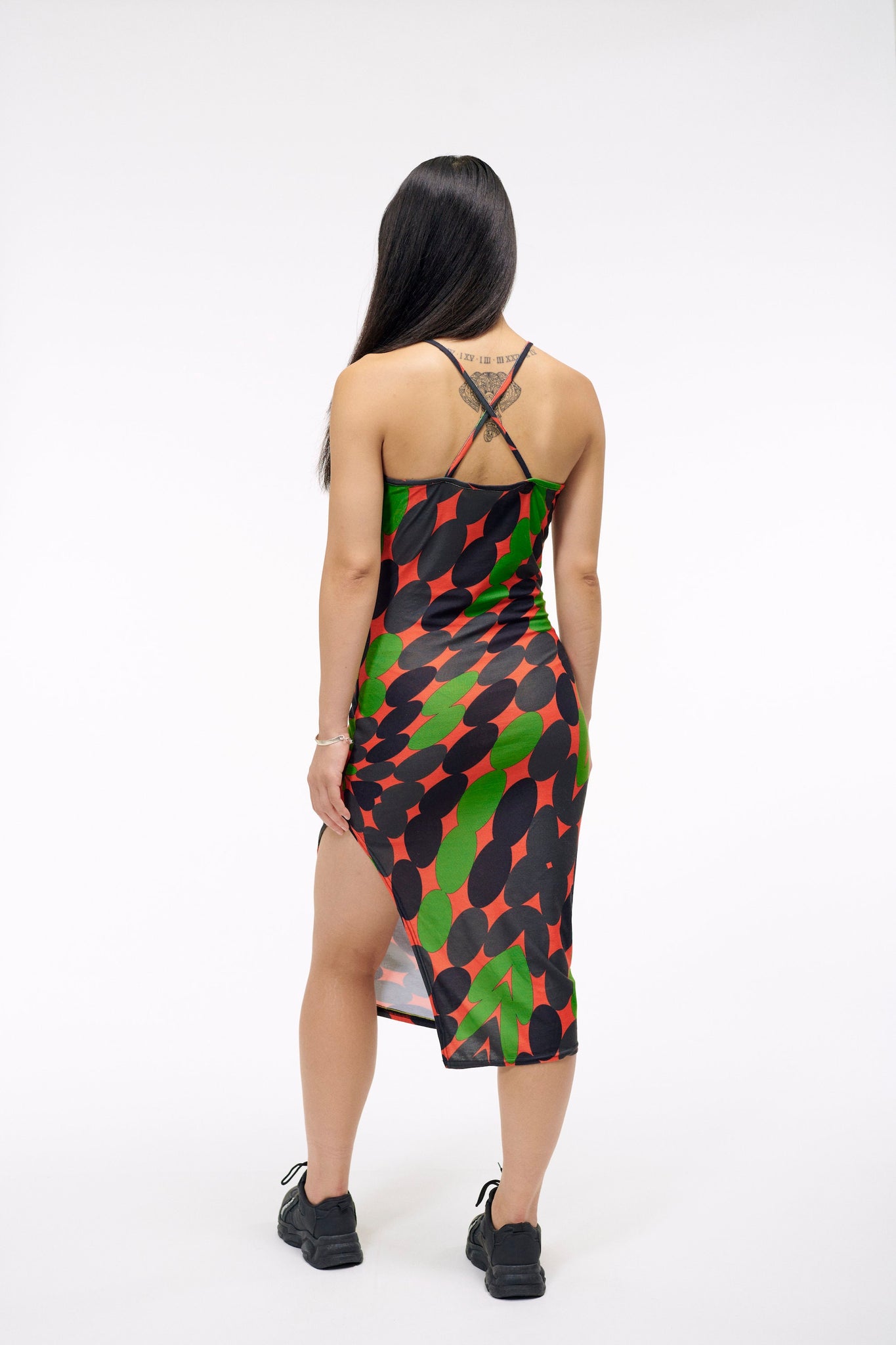 The Wicked Torque Dress | A Twisted Piece for the Fabulously Extra | Spaghetti Strap in Jersey with Black Red and Green Print | Goose Taffy